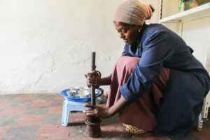 Woman preparing Ethiopian dish.
